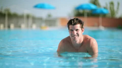 Young man relaxing in the pool; Full HD Photo JPEG Stock Footage 10758521