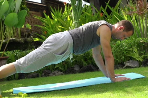 Young man resting after workout in the garden NTSC Stock Footage 39966541