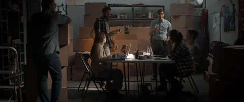 Young man reveals the first samples of product being developed by a startup team Stock Footage 145533935