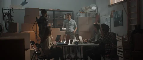 Young man reveals the first samples of product being developed by a startup team Stock Footage 145534148