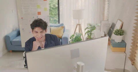 Young Man Reviewing Financial Data and Coding on Computer. Stock Footage 273840466