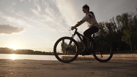 Young man ride the bike Stock Footage
