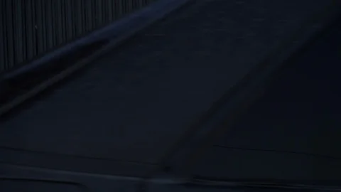 A young man rides a car back. Side view. Stock Footage 128208304