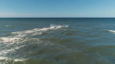 A Young Man Rides A Jet Ski Drifting On The Waves Stock Footage 122018940