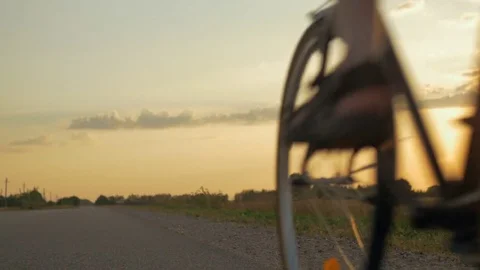Young man riding a bicycle and enjoying freedom outdoors. 動画素材 78647385
