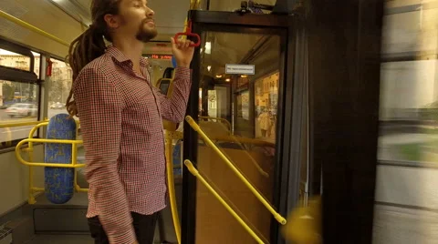 A young man riding a bus Stock Footage 65288347