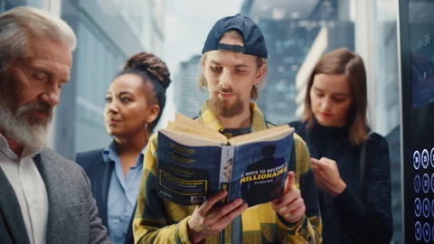 Young Man Riding Elevator Reading Book 스톡 동영상 167836886