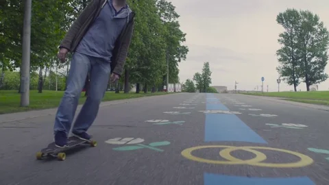 Young man riding on longboard Video stock 76507336