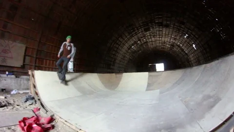 A young man riding in the mini ramp on a skateboard Video stock 69789431