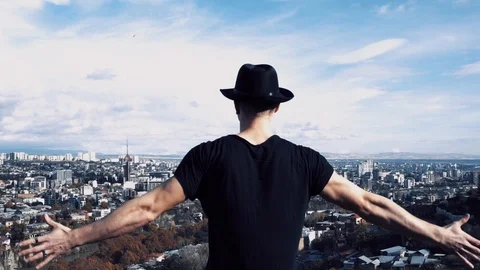 Young man rises hands Stock Footage 99003270