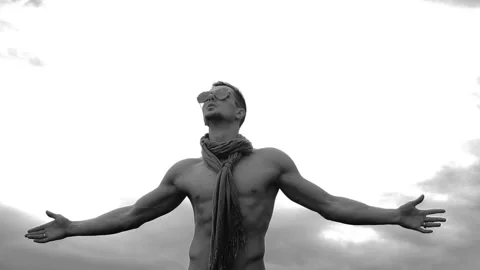 Young man rises hands on sky background Stock Footage 90754709