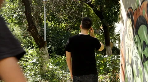 Young Man Robs Another Man With A Gun, Dangerous, Stealing, Back Shot Stock Footage 41544525