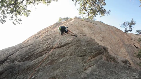 Young Man Rock Climbing Stock Footage 38645323