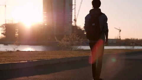Young Man Rolling on a Skateboard Stock Footage 75251083