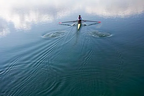 Young man rowing Stock Photos
