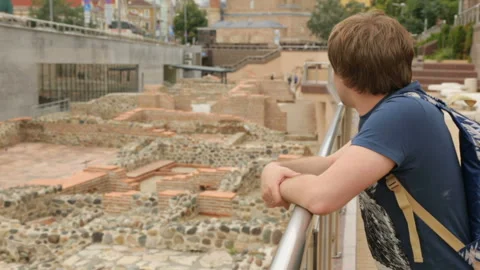 Young man at ruins of Serdica in Sofia Stock Footage 96040576