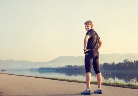 Young man runner before start Stock Photos