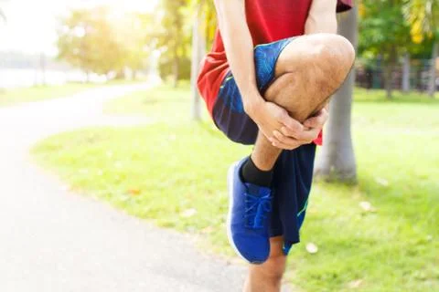 Young man runner warm up before run - workout concept Stock-Fotos
