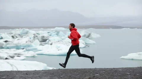 Young Man Running And Jogging By Frozen Lake - Fitness Sport Healthy Lifestyle Stock Footage 54079010