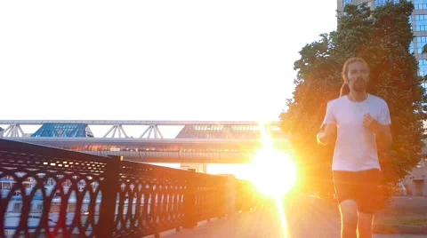 A young man is running Stock Footage 64967729