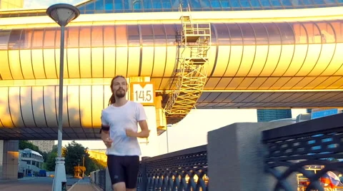 A Young man is running Stock Footage 64968316