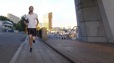 A young man is running Stock Footage 65111669