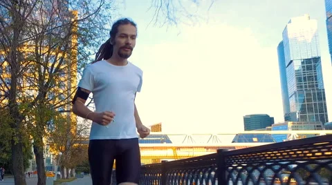 A young man is running Stock Footage 65111792