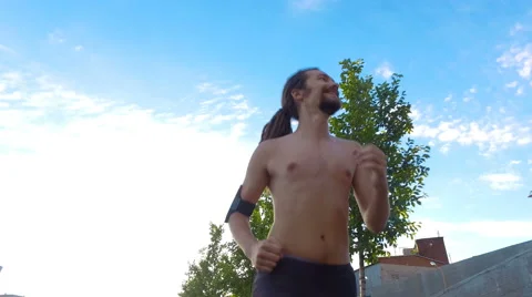 A young man is running Stock Footage 65112572