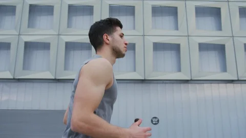 Young man running Stock Footage 100030893