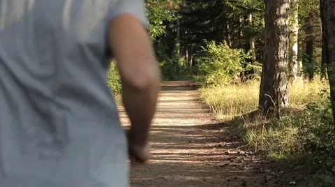 Young Man Running in the Forest Stock Footage 55838124