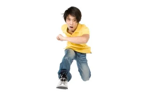 Young man running forward Stock Photos