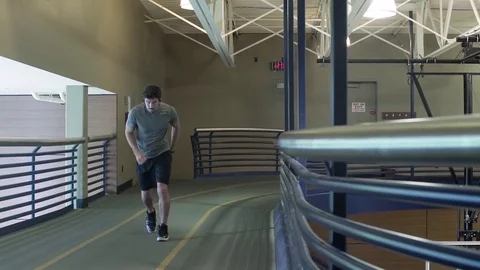 Young man running in a gym 動画素材 83391952