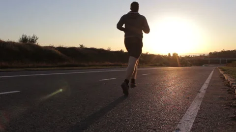 Young man running outdoors in the evening 스톡 동영상 55100101