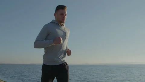 Young Man Is Running Outside Stock Footage 165656505