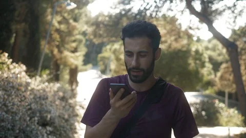 Young man running runner use sports smartphone app, fitness training outdoor Stock Footage 118893298