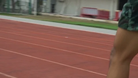 Young man is running in the track. To prepare for the competition Stock Footage 87817515