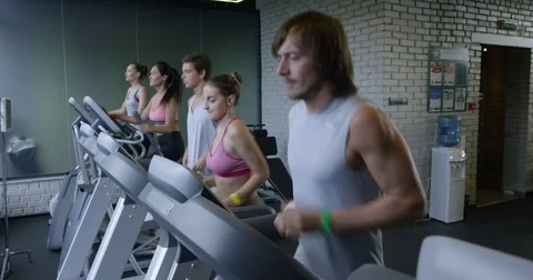 Young Man Running on a Treadmill Stock Footage 82227351
