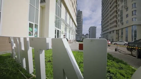 Young man runs and jumps over fitness club logo during extreme parkour training Stock Footage 276377621