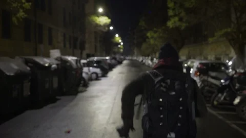 A young man runs on an empty street in Rome's suburbs Stock Footage 101357771