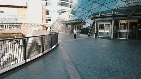 Young man runs. Handsome guy in hurry to meeting. Slow motion Stock Footage 132311396