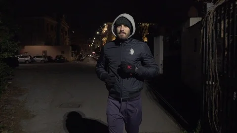 A young man runs through a gate Stock Footage 101974043