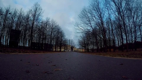 Young man runs towards the camera. It seems to be early dark morning. Stock Footage 115500911