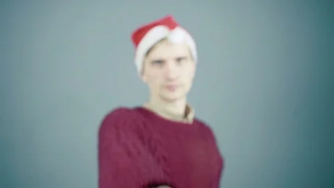 Young man in santa hat showing thumb up Stock Footage 70261044