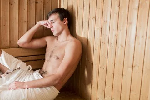 Young man in the sauna Stock Photos
