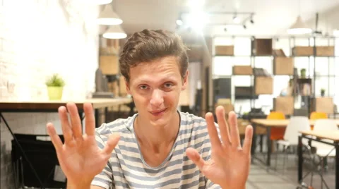 Young man saying stop; denial gesture , rejecting , no Stock Footage 65779130