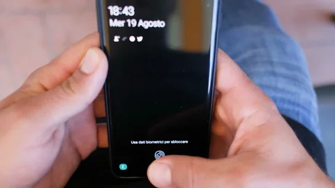 Young man Scanning Fingerprint For Security unlock On Smartphone. Cyber Security Stock Footage 137775040