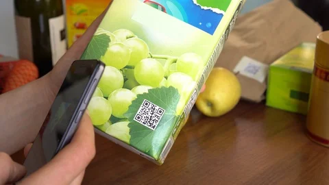 Young Man Scanning a QR Code on Product Label and Packaging Видео 103074885