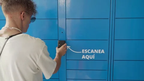 Young man scanning a qr code with a phone Stock Footage 275746725