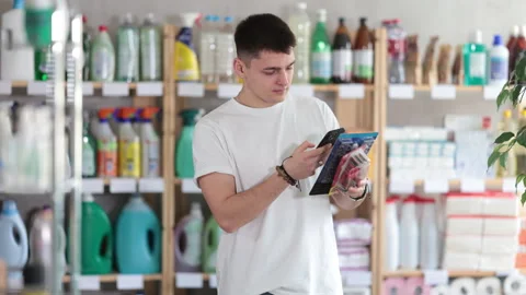 Young man scanning qr code for razor Video stock 310317325