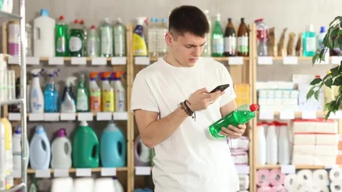 Young man scanning qr code for dishwashing Stock Footage 343708655